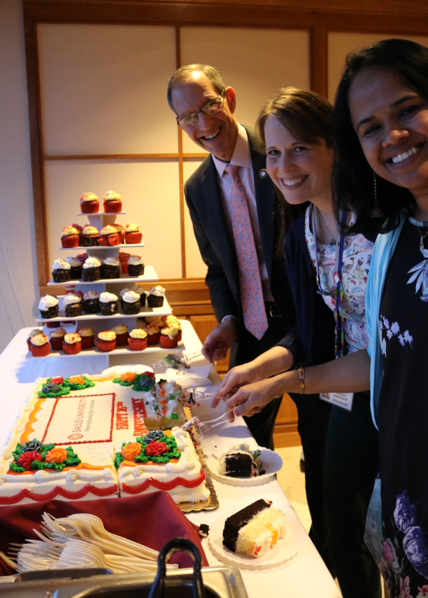 Drs. Mittelman, Bondurant and Aravamudhan cut into the cake 