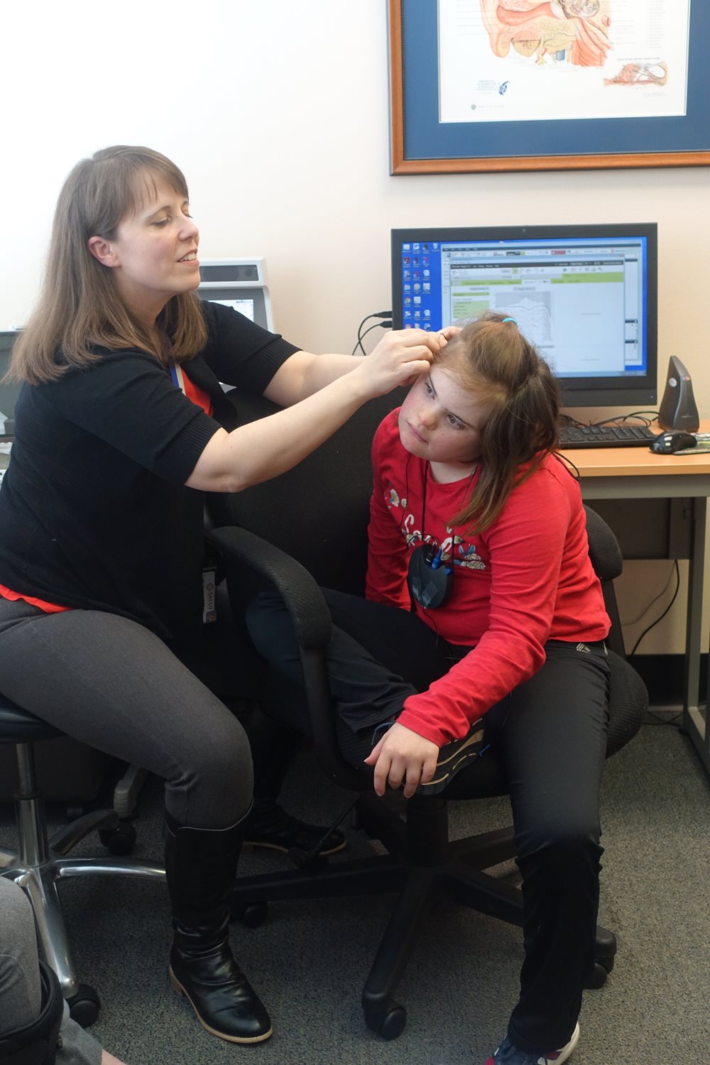 Peyton Hunt getting an ear exam