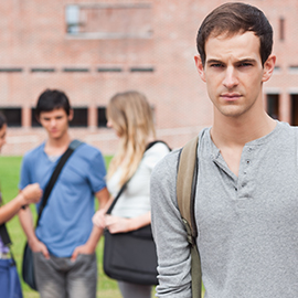 male student standing alone