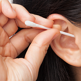 Woman using Q-tip