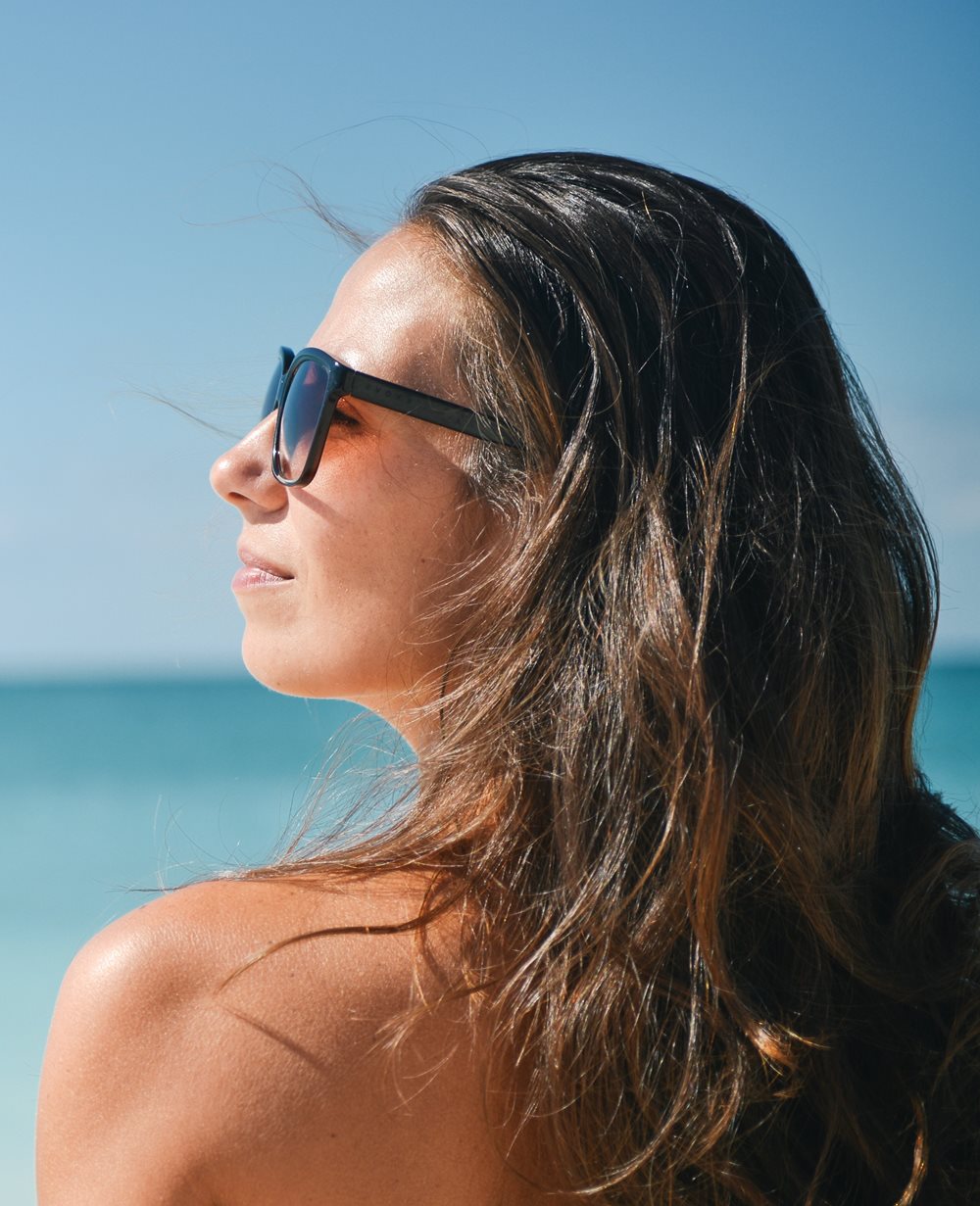 Woman wearing sunglasses on the beach