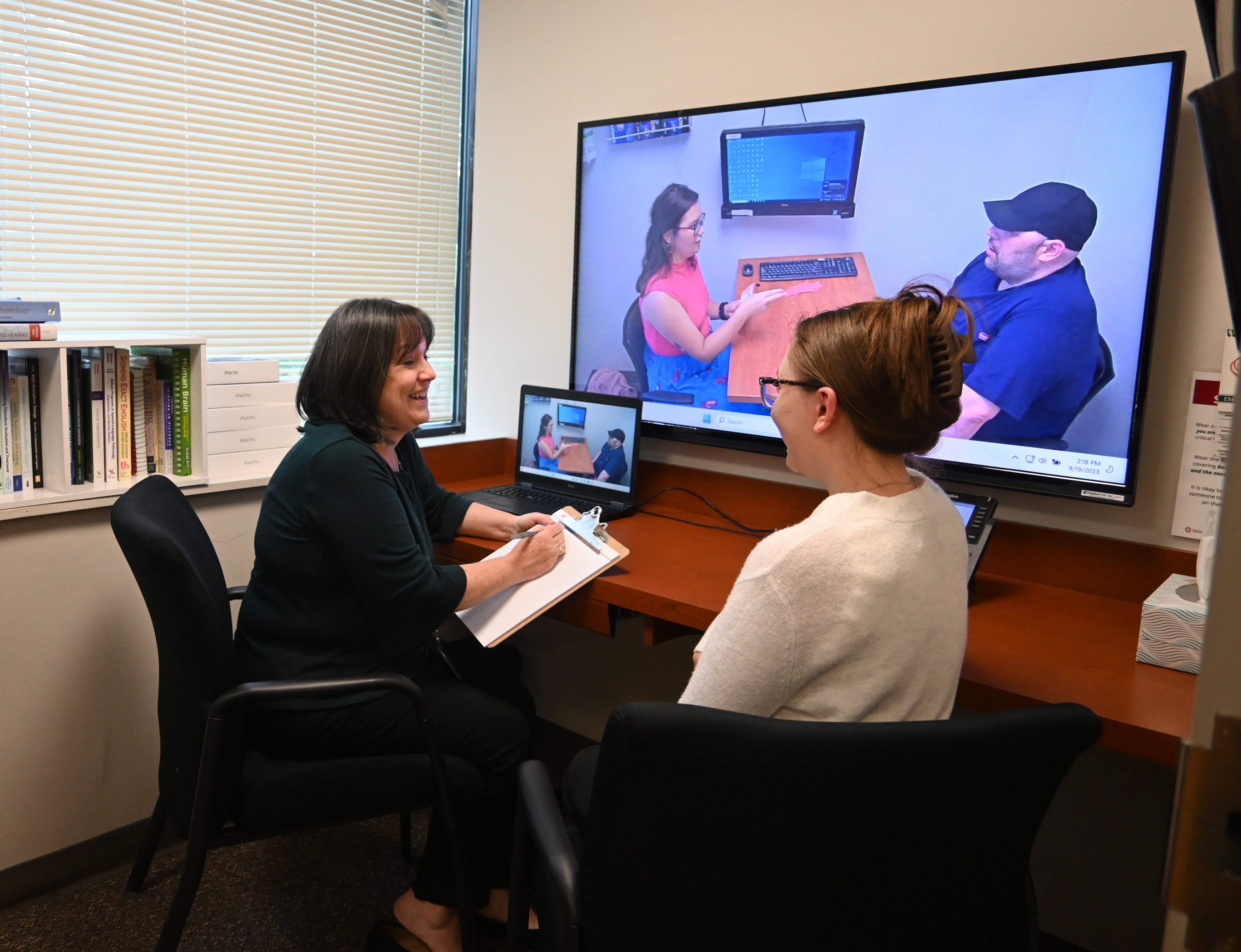 SLI staff working with patients