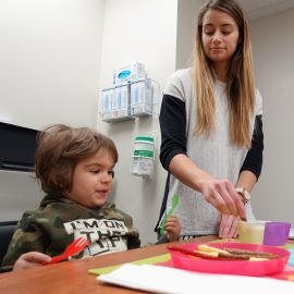 Toddler with speech language therapist 