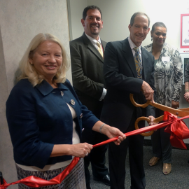 Salus leadership cutting the ceremonial ribbon