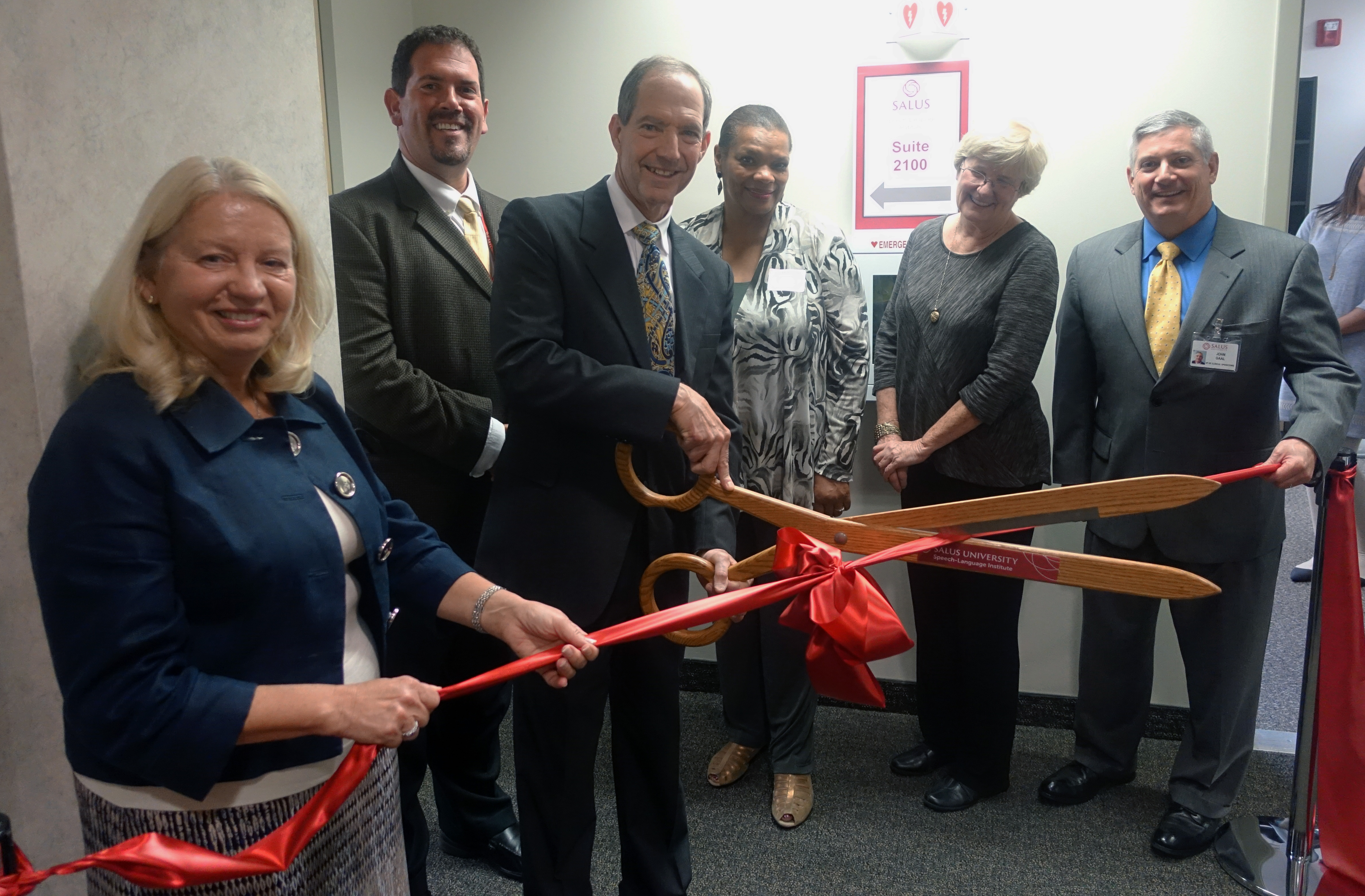 Salus leadership cutting the ceremonial ribbon