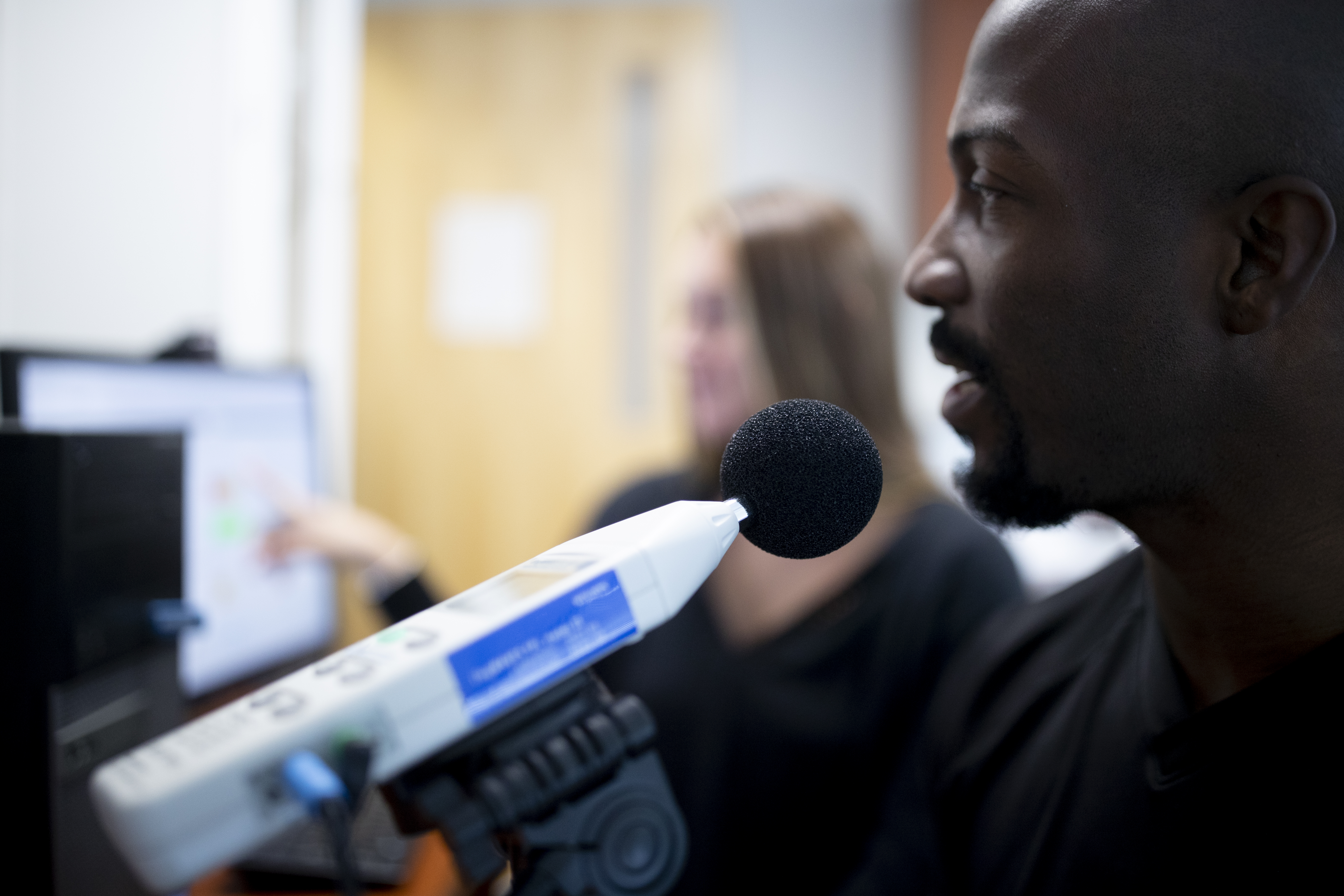 Patient speaking into microphone