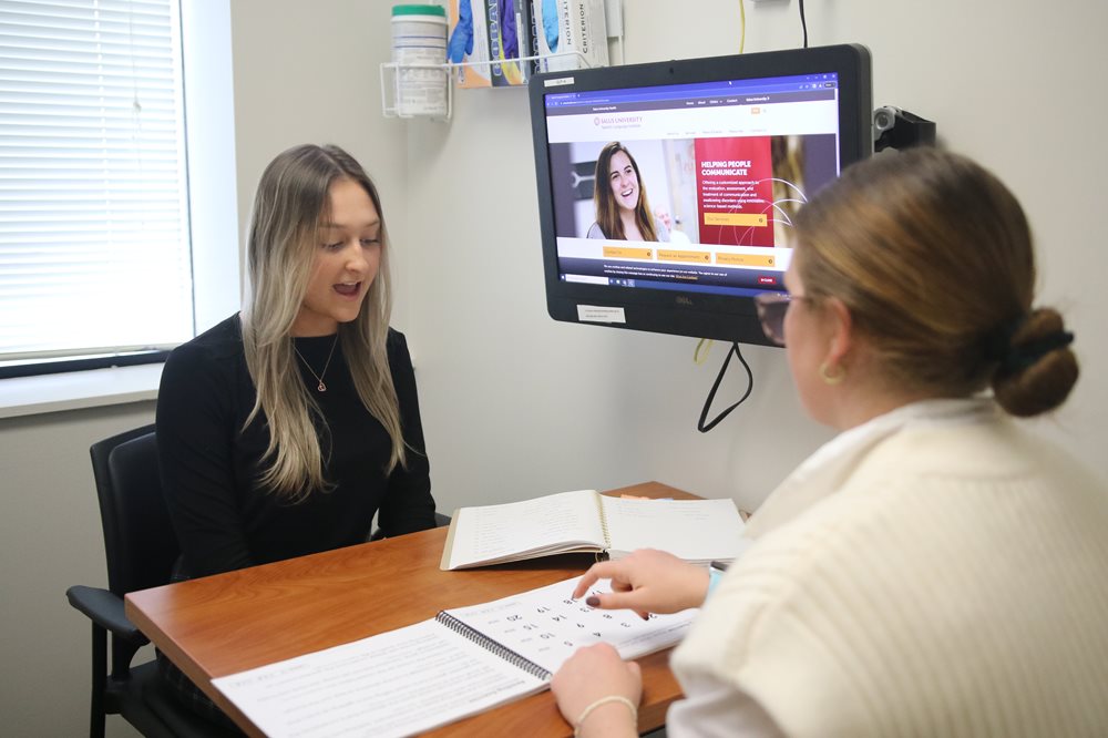 Speech Language Pathologist with patient