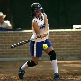 girl playing softball