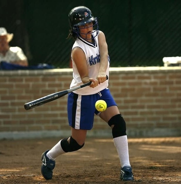 Girl playing softball