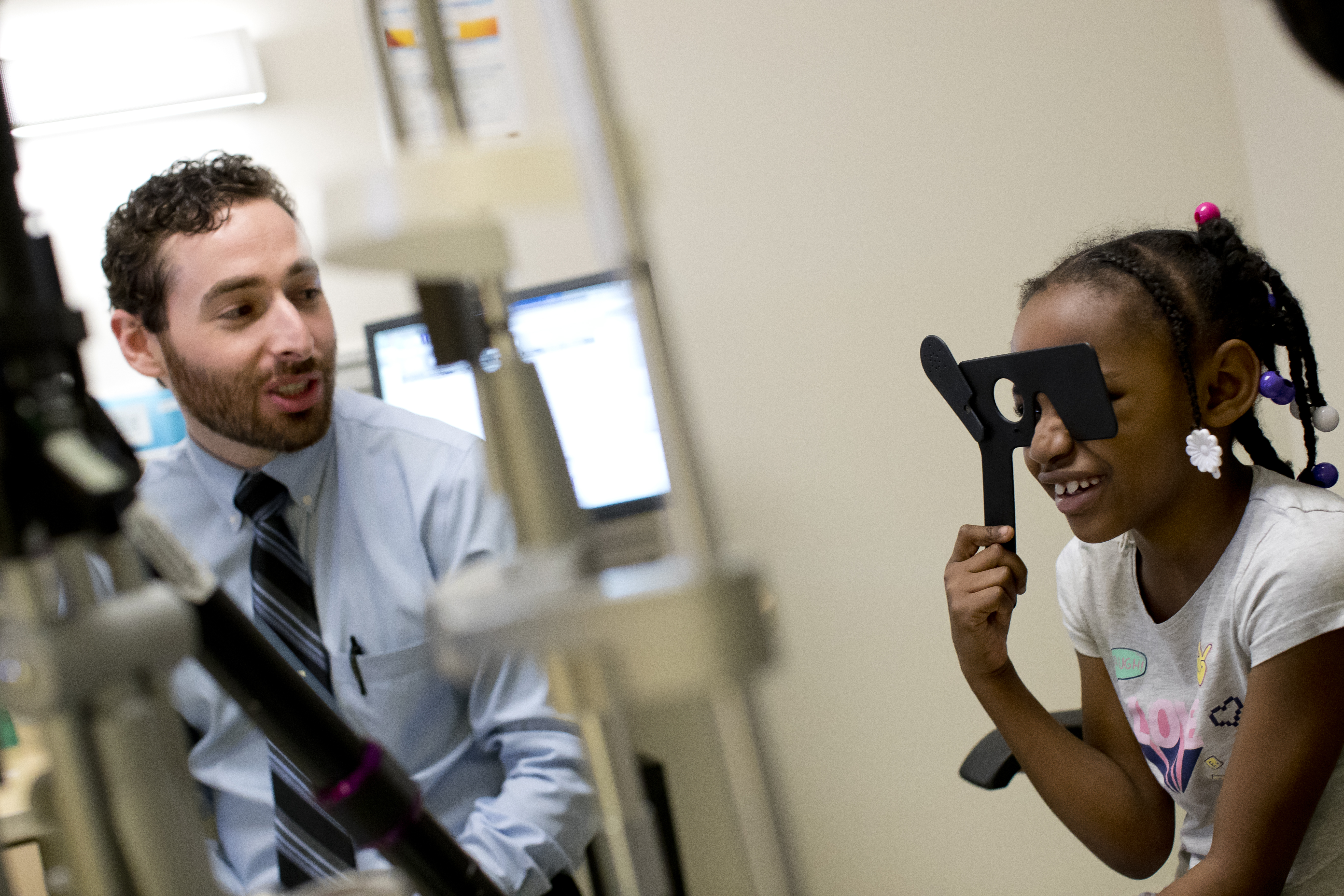 child having eye exam