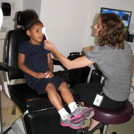 Young girl getting an eye exam