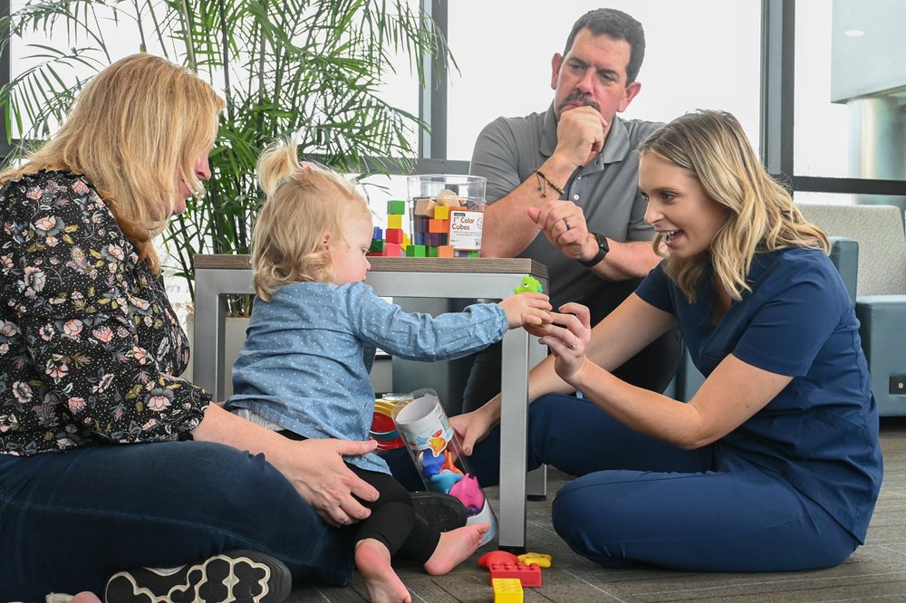 young girl with speech-language pathologist