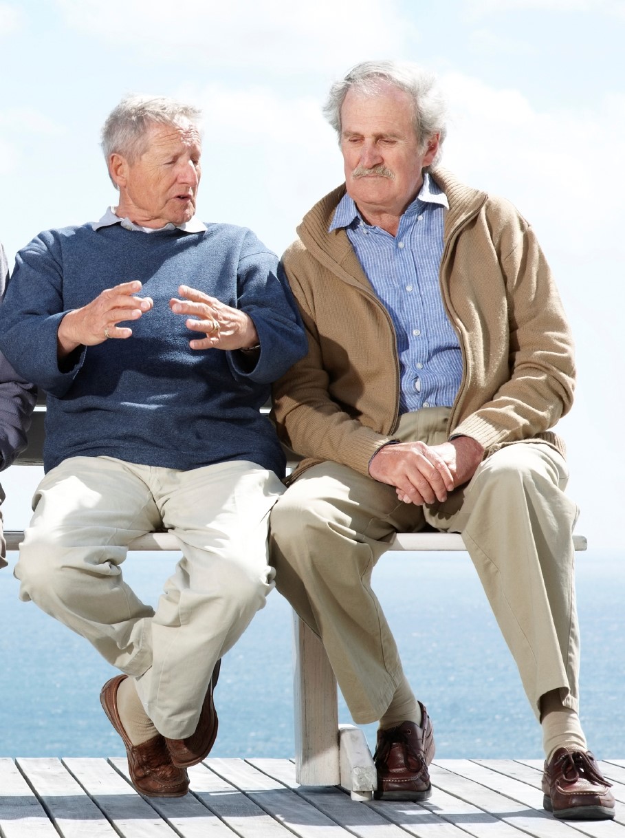 two elderly men talking