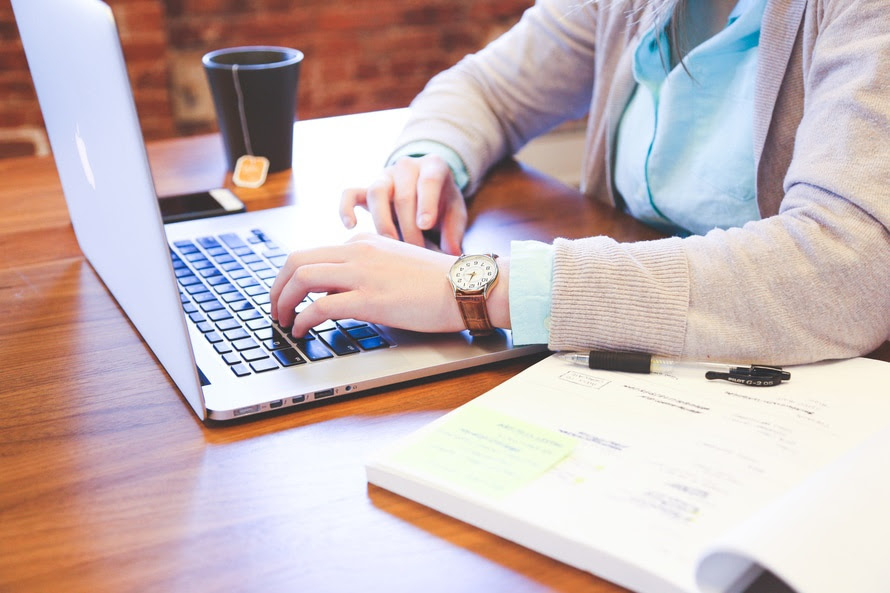 Person typing on a computer