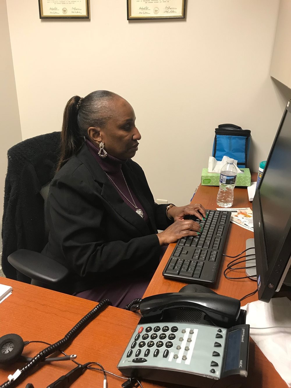 Virginia Scott working at her desk