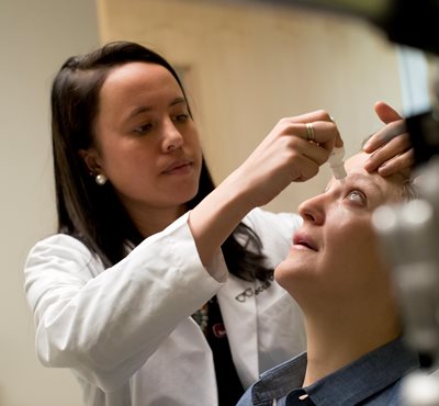 Woman getting eye drops