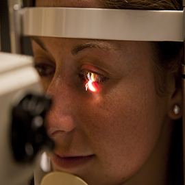 Woman having eye exam