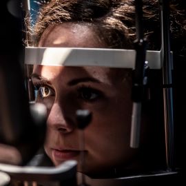 Woman having eye exam