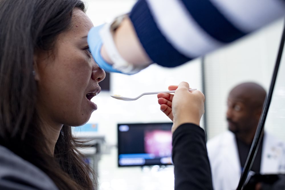 Woman having swallowing test