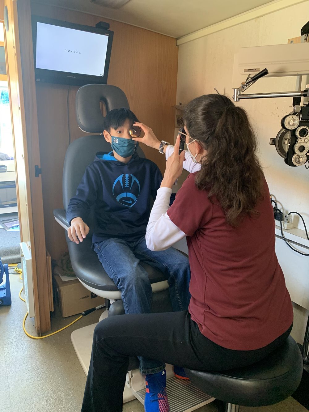 Young boy having eye exam