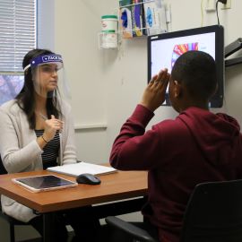 Young boy with speech therapist